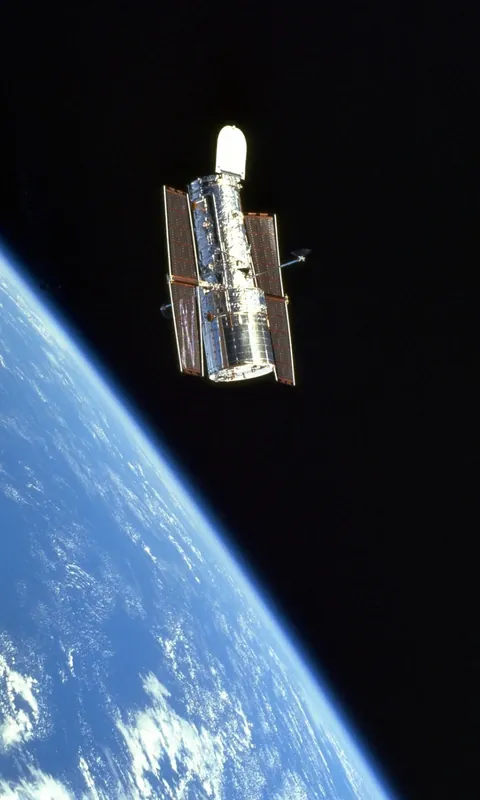 Hubble Space Telescope photographed above Earth from the Space Shuttle