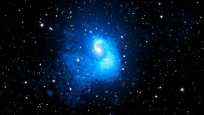Chandra X-ray composite image of galaxy cluster Abell 2029, showing a two-million-light-year sloshing spiral of hot gas left by a billion-year-old cluster merger.