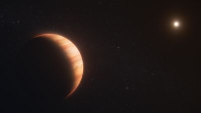 Artist's concept of exoplanet WD 1856 b, a Jupiter-sized world silhouetted against its host white dwarf star WD 1856+534.