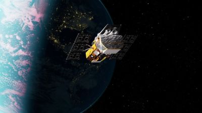 Illustration of NASA's Neil Gehrels Swift Observatory in low Earth orbit above the night-lit Earth.