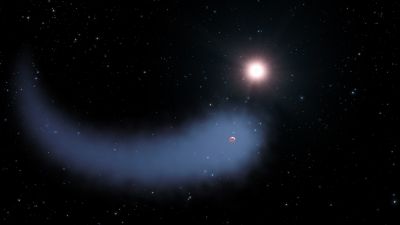 Artist illustration of a hot Neptune-sized exoplanet whose hydrogen atmosphere is evaporating into a vast comet-like tail around its host star