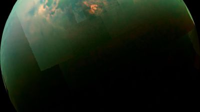 Cassini image of sunlight glinting off Titan's northern hydrocarbon lakes, a specular reflection analogous to ocean glint on an Earth-like exoplanet.