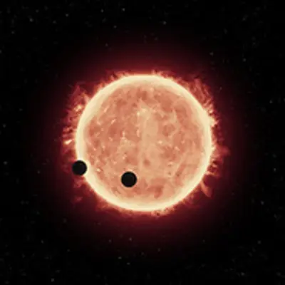 Artist's View of Planets Transiting Red Dwarf Star in TRAPPIST-1 System