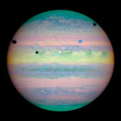 Three Moons Cast Shadows on Jupiter