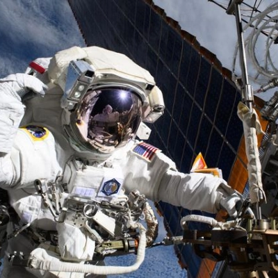 Astronaut Anne McClain is pictured near one of the International Space Station's main solar arrays