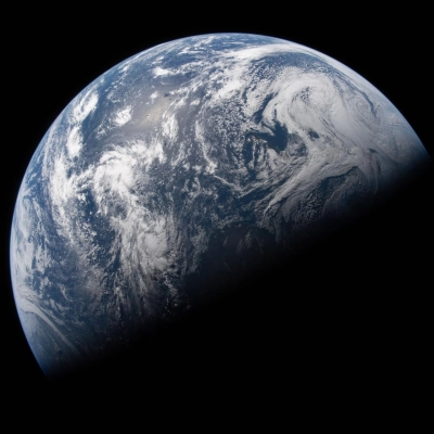 art002e023506 (April 2, 2026) - Earth is illuminated against the blackness of space in this photo taken by an Artemis II...
