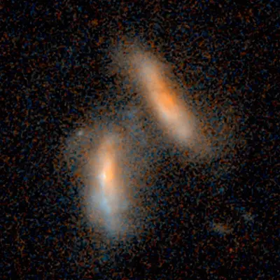 Merging Galaxies - 2.4 Billion Light-Years from Earth