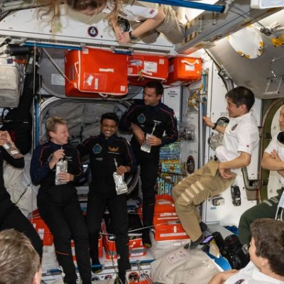 The Axiom Mission 4 private astronauts gather inside the International Space Station