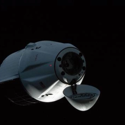 A SpaceX Dragon cargo spacecraft approaches the International Space Station