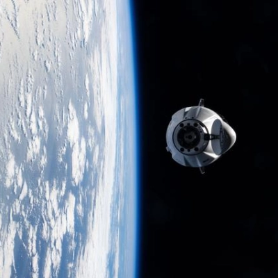 A SpaceX Dragon cargo spacecraft approaches the International Space Station