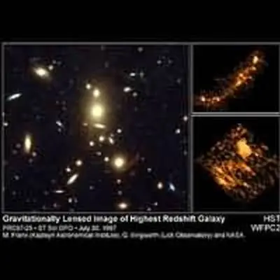 Galaxy Cluster Magnifies Light of More-Distant Galaxy