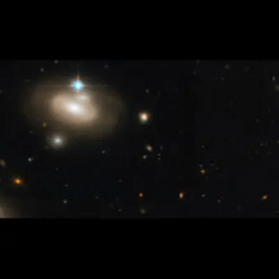 Lenticular Galaxy in the Coma Cluster with Numerous Background Galaxies, a Detail of a Larger Hubble Image