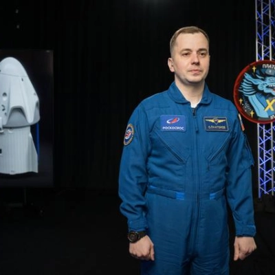 Roscosmos cosmonaut Oleg Platonov poses for a photo during an interview