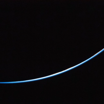 art002e023710 (April 3, 2026) - A sliver of the edge of Earth is brightly illuminated against the vast darkness of...