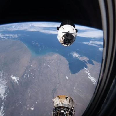 A SpaceX Dragon spacecraft backs away from the International Space Station