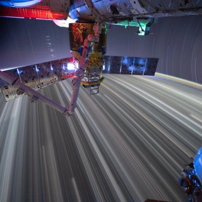 Star trails and city lights streak as the International Space Station orbits Earth