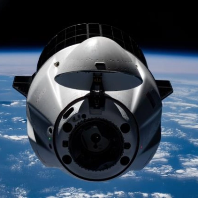 A SpaceX Dragon cargo spacecraft approaches the International Space Station