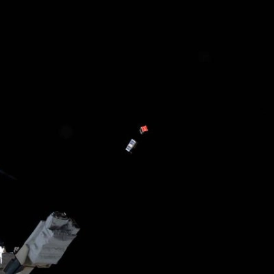 A pair of CubeSats is deployed into Earth orbit outside of the International Space Station