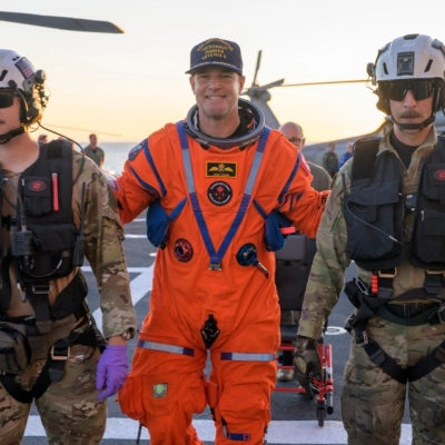 CSA (Canadian Space Agency) astronaut Jeremy Hansen, Artemis II mission specialist is assisted off the flight deck after arriving aboard...