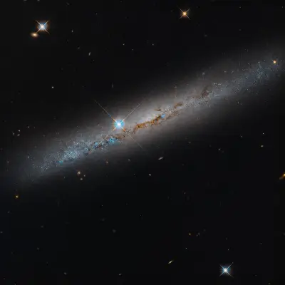 NASA’s Hubble Spies Spiral’s Edge