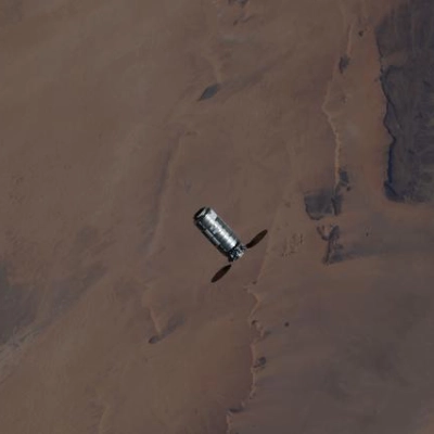 The Cygnus XL cargo spacecraft approaches the International Space Station above the Sahara