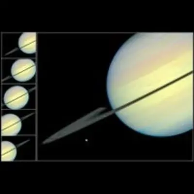 Hubble Sees Moons Racing Across Saturn