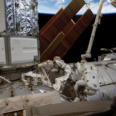 Astronaut Butch Wilmore works outside the International Space Station