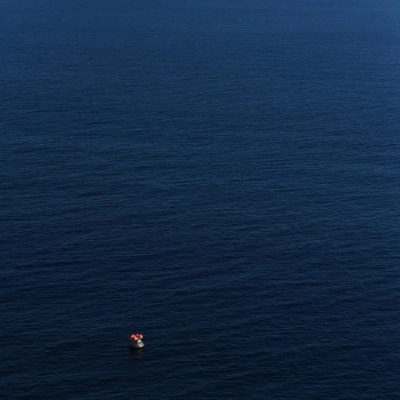 USS John P. Murtha approaches NASA's Orion spacecraft carrying Artemis II Commander Reid Wiseman, Pilot Victor Glover, and Mission Specialist...