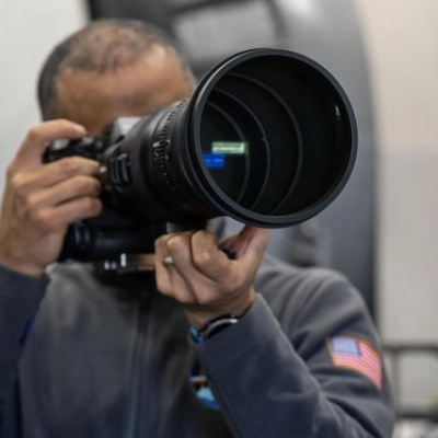 NASA astronaut Anil Menon participates in a photography training session