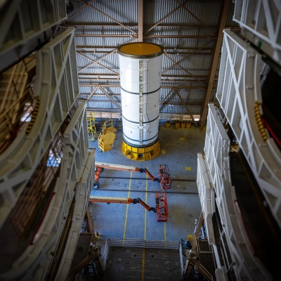 The left-hand forward solid rocket booster segment for NASA’s Artemis III SLS (Space Launch System) rocket is removed from its...