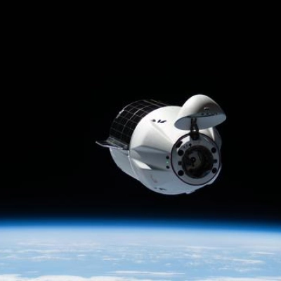 A SpaceX Dragon cargo spacecraft approaches the International Space Station