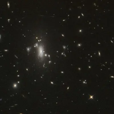 NASA’s Hubble Seeks Lensed Supernova, Marks 200,000 Orbits