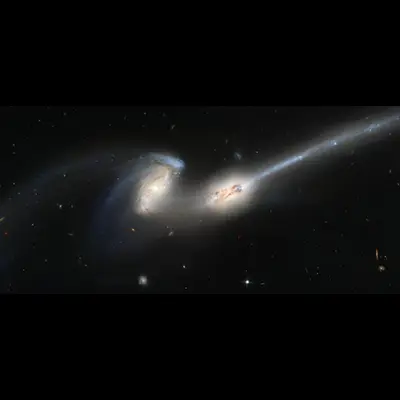 The Mice (NGC 4676): Colliding Galaxies With Tails of Stars and Gas