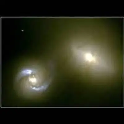 Intergalactic 'Pipeline' Funnels Matter Between Colliding Galaxies NGC 1410 and NGC 1409