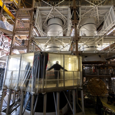 The left-hand and right-hand solid rocket booster aft segments, or bottom sections, for NASA’s Artemis III SLS (Space Launch System) rocket are seen inside the Rotation, Processing and Surge...