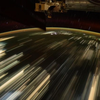 The city lights of Southeast Asia streak below the International Space Station