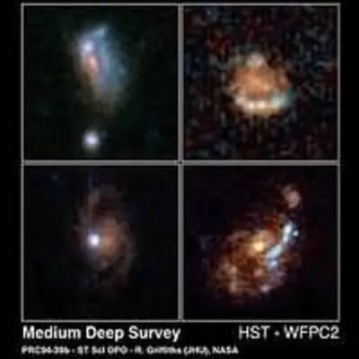 Normal Spiral Galaxies 5 to 7 Billion Light-Years From Earth