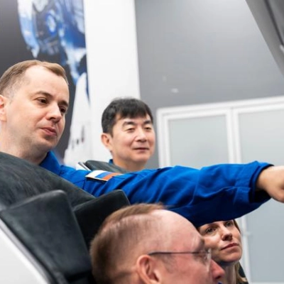 NASA's SpaceX Crew-11 members train inside a Dragon training crew spacecraft