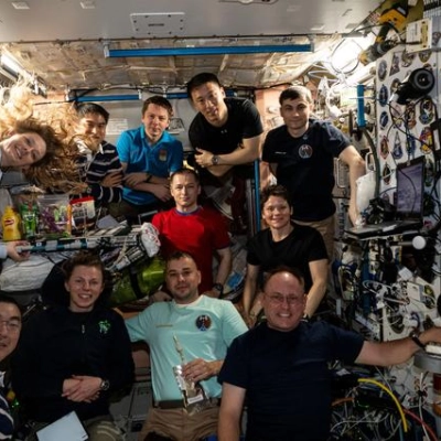 Eleven International Space Station crew members gather for a portrait
